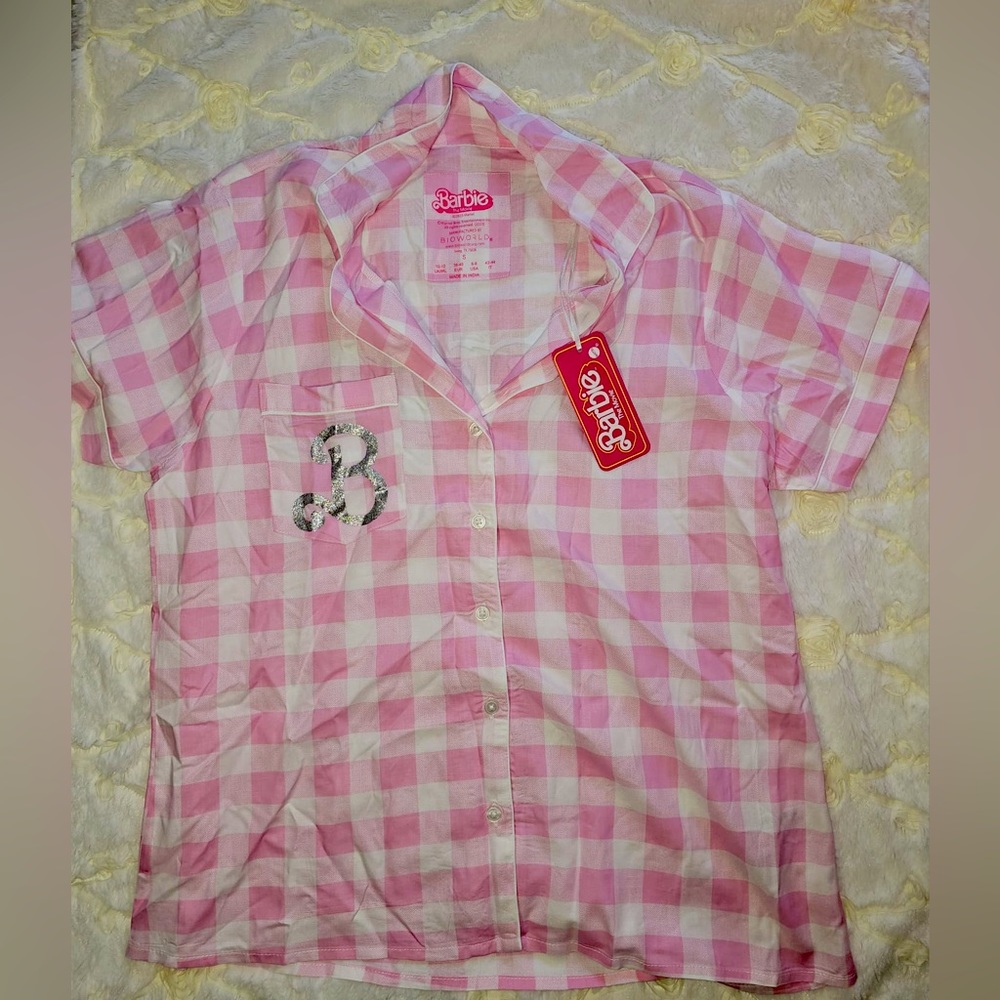 Barbie light pink button down shirt. Size S fits 6/8. Brand new with tags